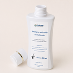 Shampoo Anticaída Revitalizante — el envase abierto, con la tapa al costado